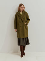 Abrigo cruzado de lana para mujer. Elegante, moderno y cómodo. Una prenda atemporal que combina estilo y calidez.