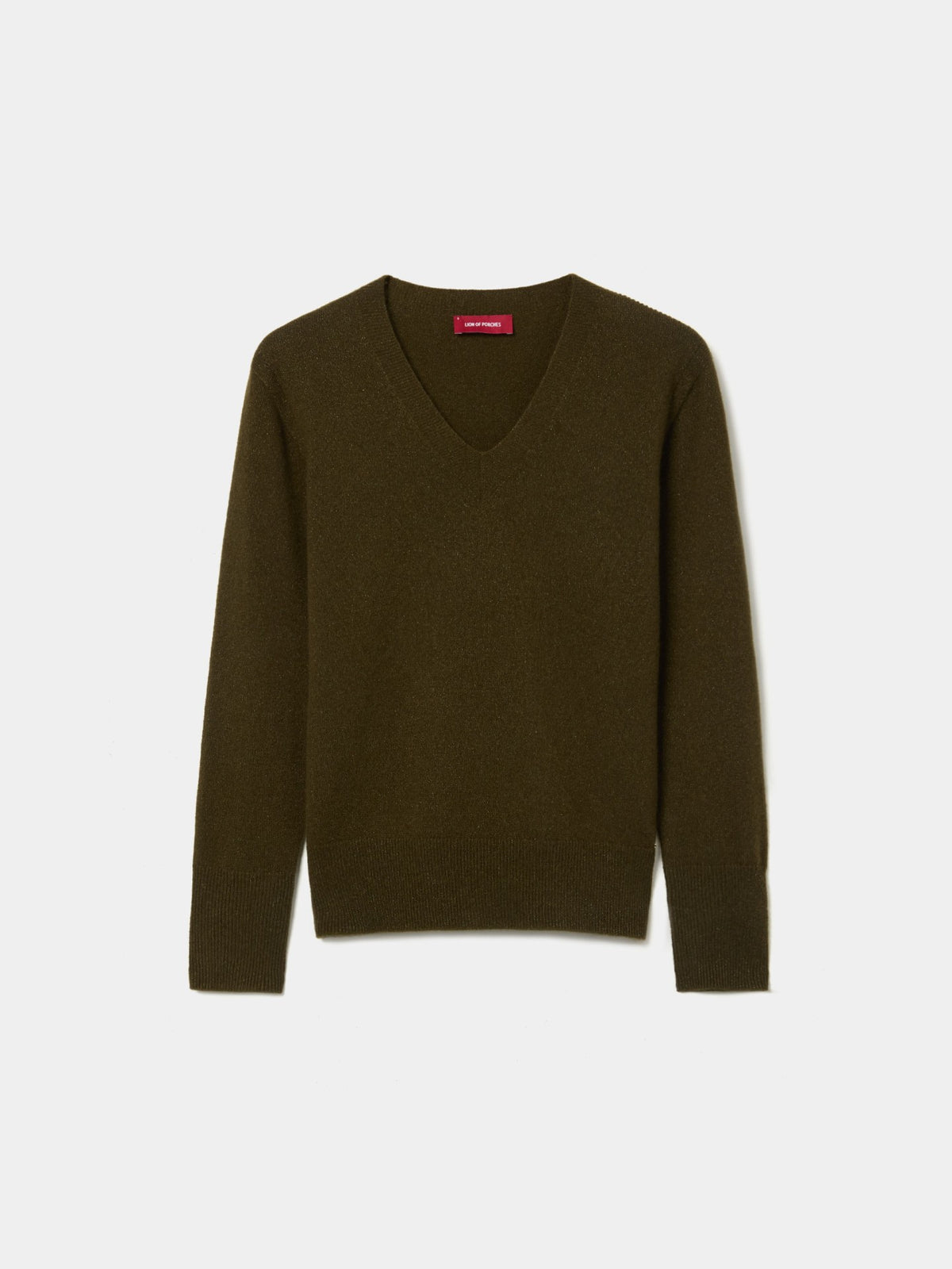 Jersey de punto con escote en V, manga larga y acabados acanalados. Confeccionado con 80% lana y 20% fibra metálica con efecto lúrex.