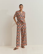 Pantalón palazzo estampado con cierre trasero Pantalón palazzo de mujer confeccionado en una mezcla de viscosa, con un tejido ligero y fluido que aporta movimiento y elegancia