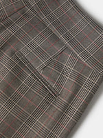 Pantalón plisado con estampado de cuadros, un diseño de inspiración clásica