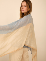 Fular jacquard con estampado y borlas