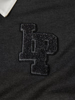 Polo de manga larga con cuello en contraste