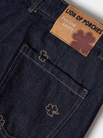 Pantalón Vaquero Ancho con Tréboles