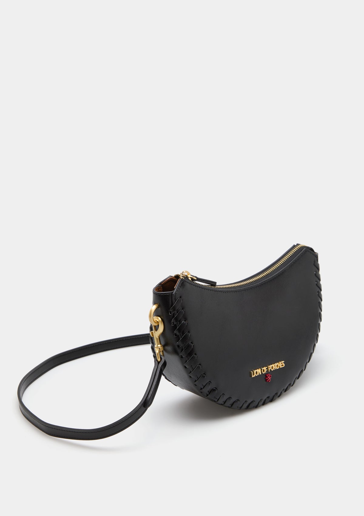 Bolso bandolera elegante con forma de media luna, detalle trenzado y asas extraíbles. Diseño sofisticado para un estilo moderno y refinado.
