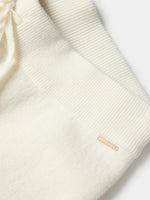 Pantalón de punto crudo de pierna ancha con cintura elástica y cordón ajustable, vista frontal