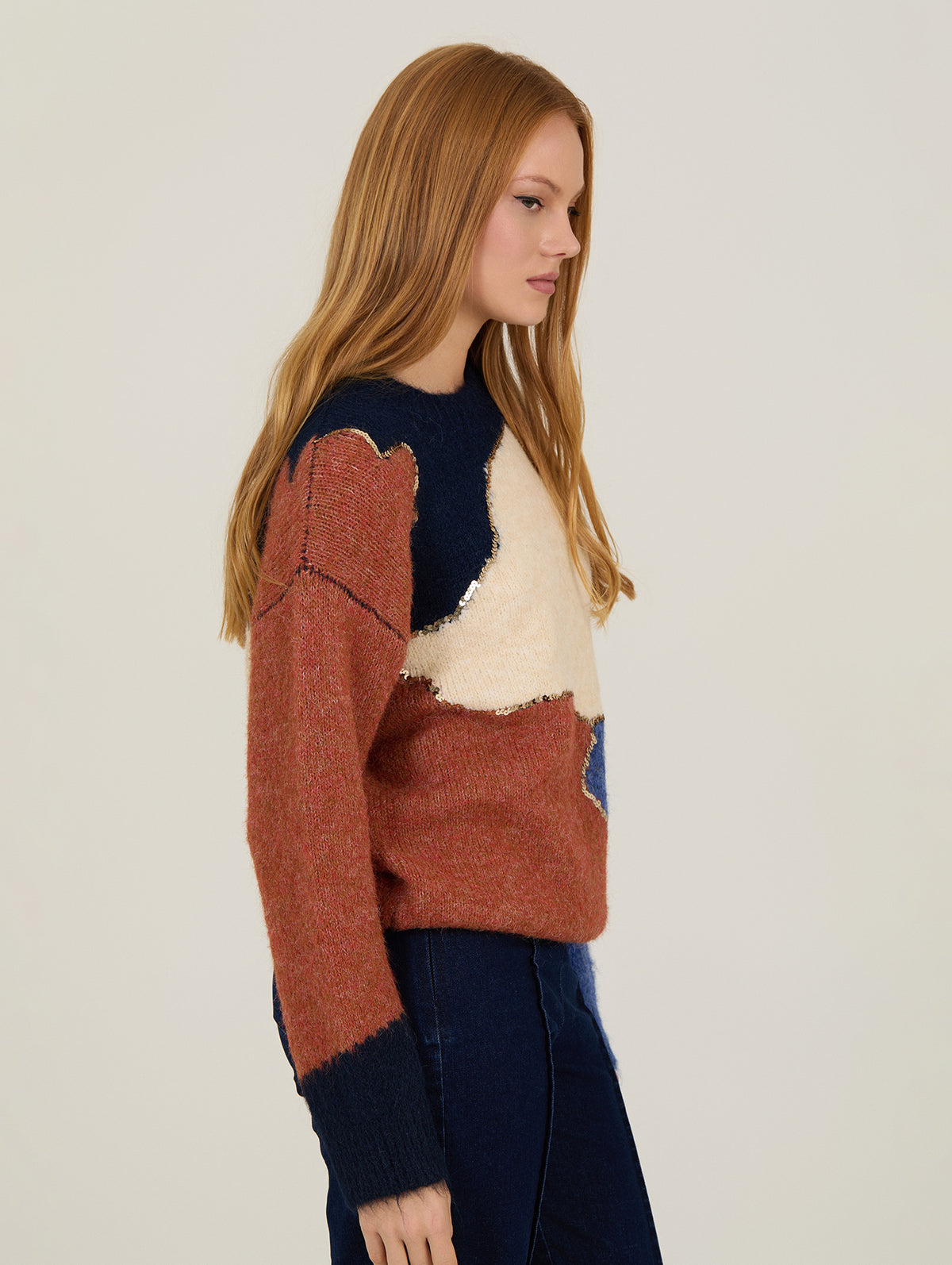 Jersey de punto elegante con lentejuelas doradas