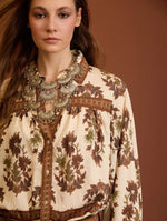 BLUSA ESTAMPADA CON MANGAS ABULLONADAS