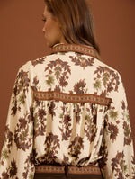 BLUSA ESTAMPADA CON MANGAS ABULLONADAS
