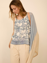 Fular jacquard con estampado y borlas
